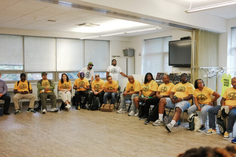 Group photo of CVILA participants sitting in a circle during class.