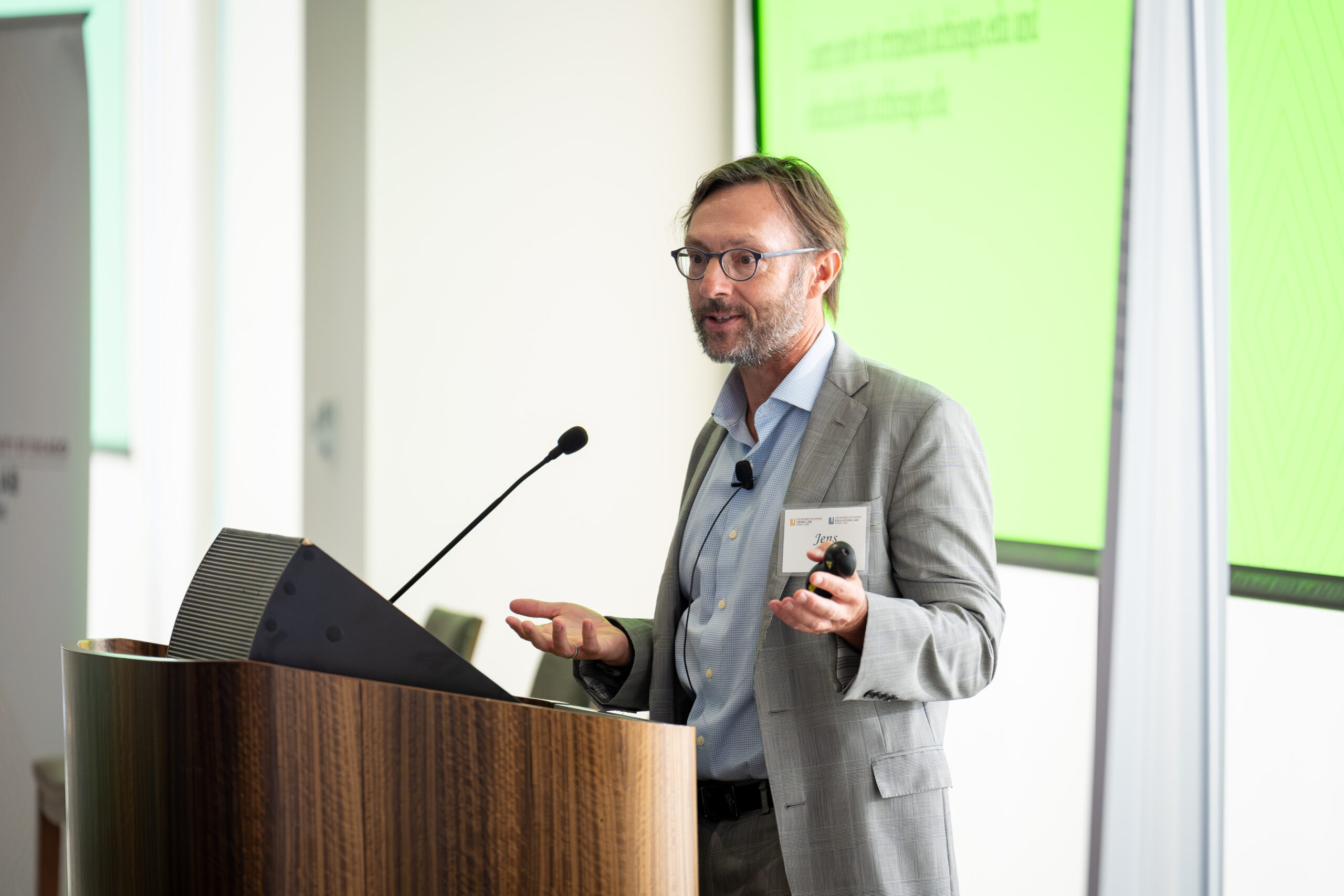 Jens Ludwig speaking at a podium