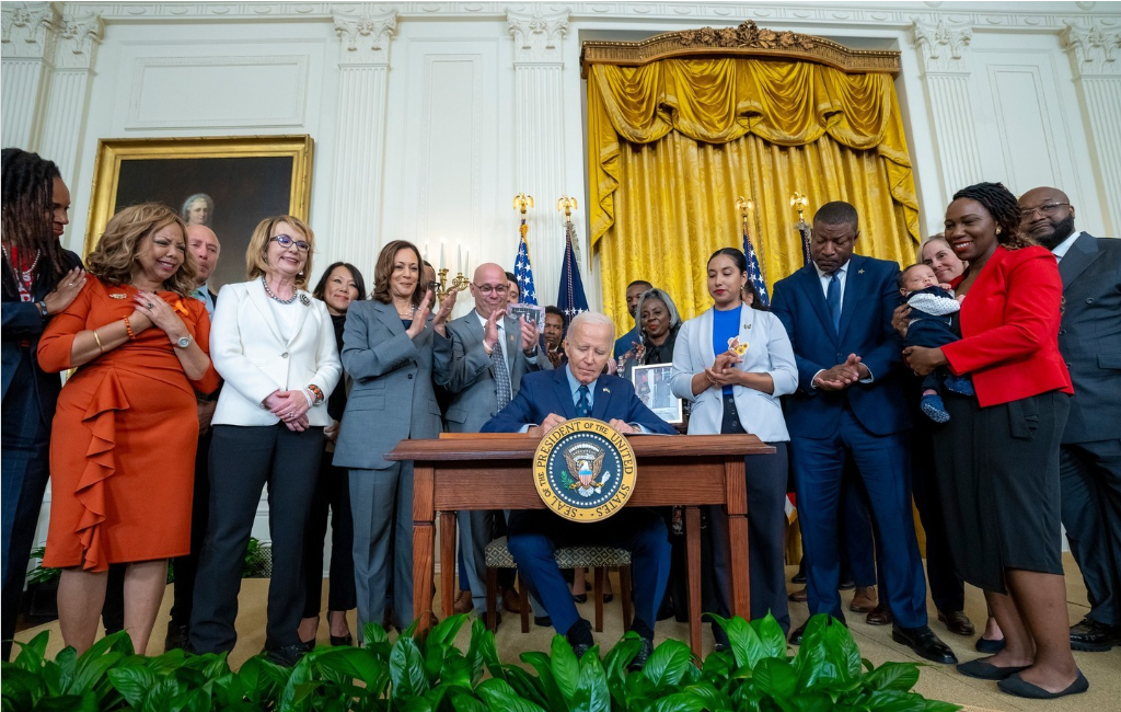 CVILA Executive Director Dr. Chico Tillmon (far right) on stage as President Joe Biden announces executive actions to reduce gun violence.